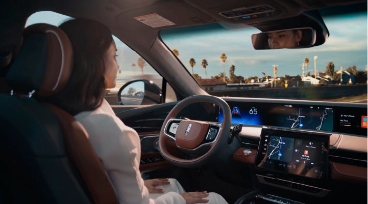 A person is shown driving hands-free on the highway with available Lincoln BlueCruise technology. | Eau Claire Lincoln in Eau Claire WI
