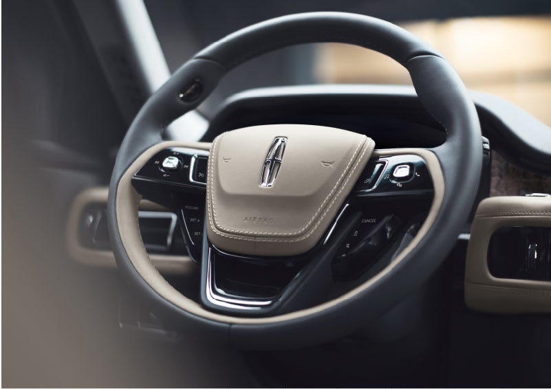 The intuitively placed controls of the steering wheel on a 2023 Lincoln Aviator® SUV | Eau Claire Lincoln in Eau Claire WI