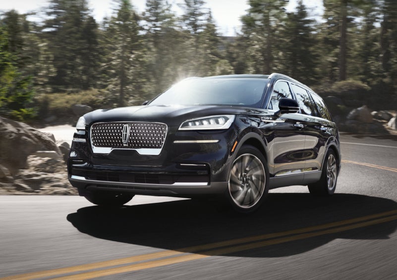 A Lincoln Aviator® SUV is being driven on a winding mountain road | Eau Claire Lincoln in Eau Claire WI