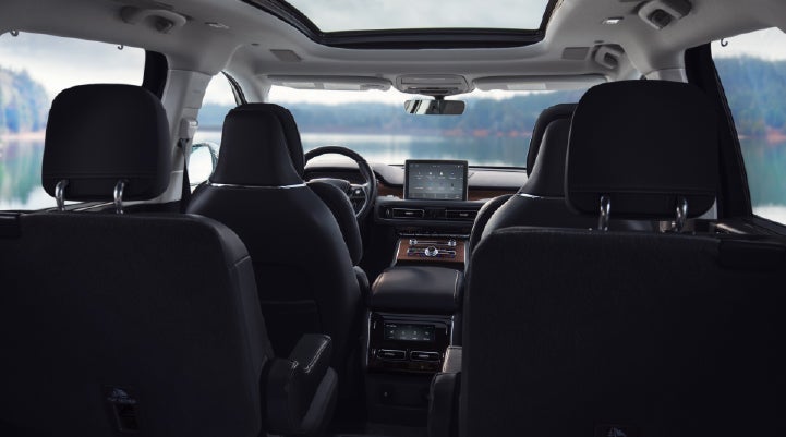 The interior of a 2024 Lincoln Aviator® SUV from behind the second row | Eau Claire Lincoln in Eau Claire WI