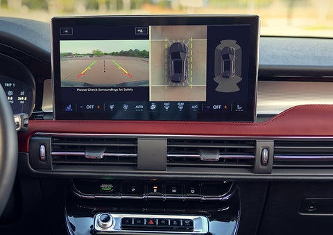 The driver of a 2024 Lincoln Corsair® SUV is shown selecting the drive mode. | Eau Claire Lincoln in Eau Claire WI
