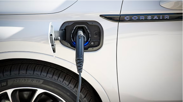 An electric charger is shown plugged into the charging port of a Lincoln Corsair® Grand Touring
model. | Eau Claire Lincoln in Eau Claire WI