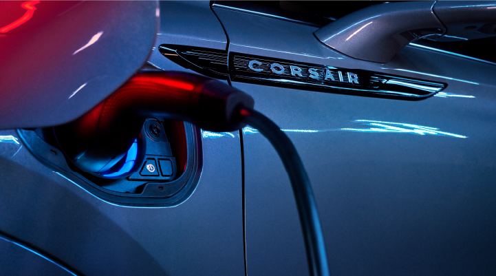 A charger plugged into the charging port of a 2025 Lincoln Corsair® Plug-in Hybrid model. | Eau Claire Lincoln in Eau Claire WI