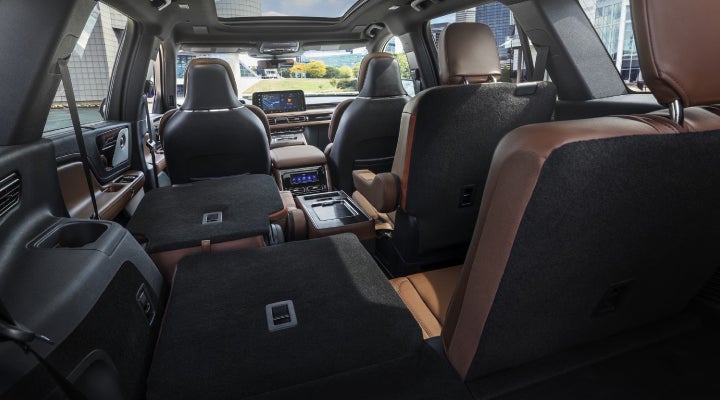 One side of the PowerFold® third-row seat and a second-row seat are folded forward in the 2026 Lincoln Aviator® SUV. | Eau Claire Lincoln in Eau Claire WI