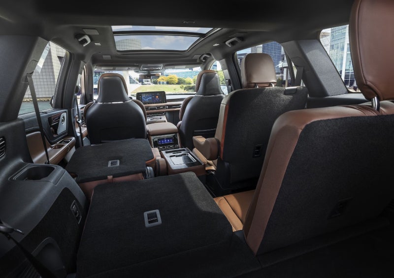 One side of the PowerFold® third-row seat and a second-row seat are folded forward in the 2026 Lincoln Aviator® SUV. | Eau Claire Lincoln in Eau Claire WI