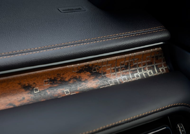 A close-up shot of the 2026 Lincoln Aviator® dashboard with unique black and brown accents and brown stitching. | Eau Claire Lincoln in Eau Claire WI