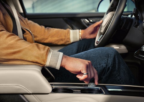 The driver of a 2026 Lincoln Corsair® SUV is shown selecting a drive mode. | Eau Claire Lincoln in Eau Claire WI