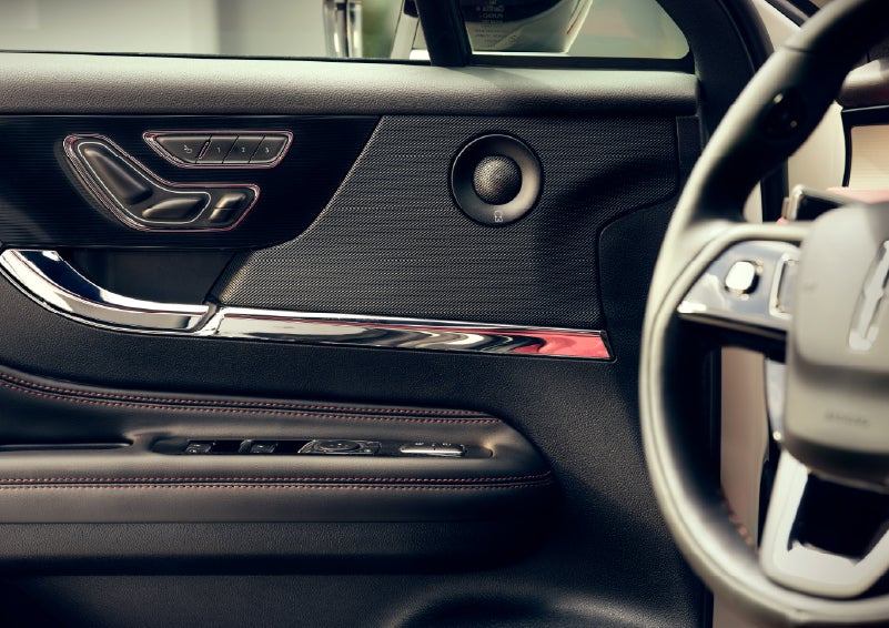An audio speaker is shown in the driver's side door of a 2026 Lincoln Corsair® SUV | Eau Claire Lincoln in Eau Claire WI